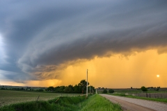 sun behind rain curtain Iowa landscape